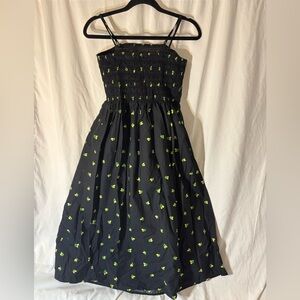 A New Day Women's Summer Smocked Midi Sundress in black with a lemon print.